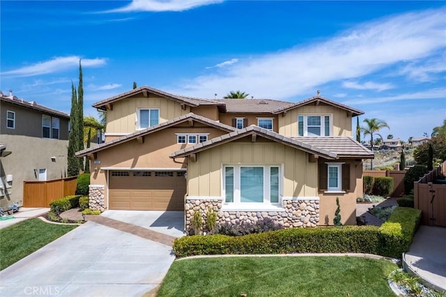 33850 Sattui St, Temecula, CA 92592 - craftsman-style home featuring stone siding, concrete driveway, board and batten siding, and a garage