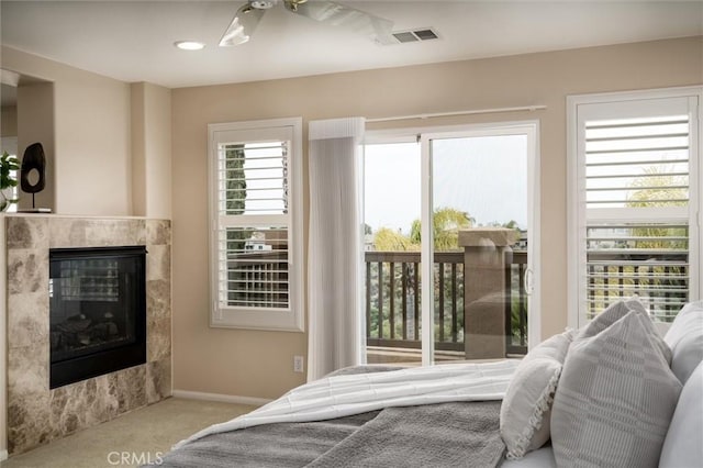 33850 Sattui St, Temecula, CA 92592 - carpeted bedroom featuring a glass covered fireplace and baseboards