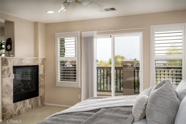 33850 Sattui St, Temecula, CA 92592 - carpeted bedroom featuring a glass covered fireplace and baseboards