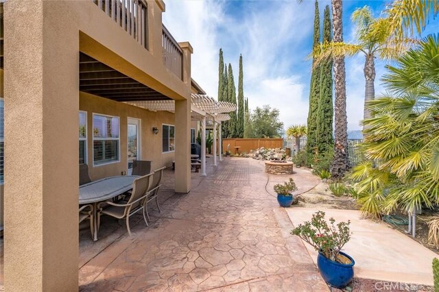 33850 Sattui St, Temecula, CA 92592 - view of patio / terrace with a pergola, outdoor dining space, and a fire pit