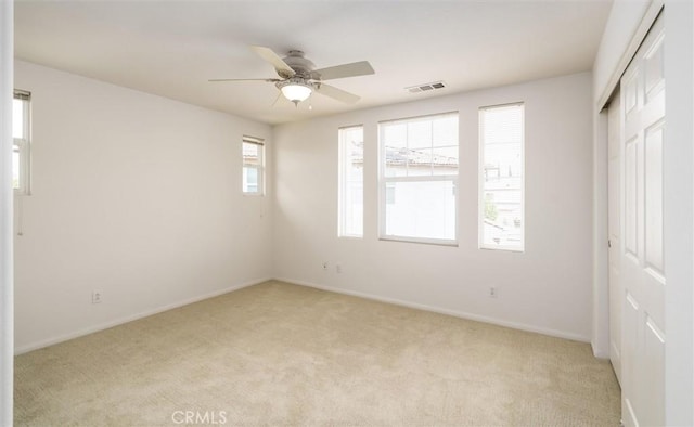 33850 Sattui St, Temecula, CA 92592 - unfurnished bedroom with light colored carpet, a closet, baseboards, and a ceiling fan