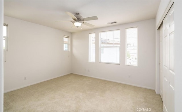 33850 Sattui St, Temecula, CA 92592 - unfurnished bedroom featuring light colored carpet, a closet, and ceiling fan