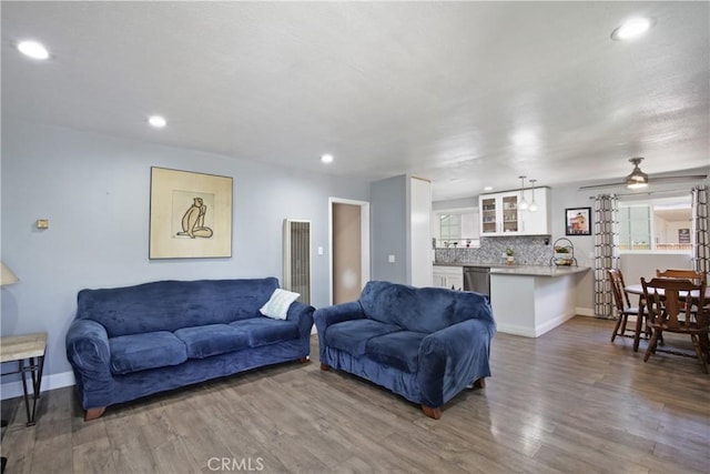 10108 Roseton Ave, Santa Fe Springs, CA 90670 - living area with wood finished floors, recessed lighting, baseboards, healthy amount of natural light, and a heating unit