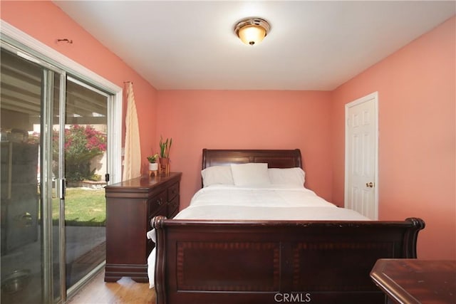10108 Roseton Ave, Santa Fe Springs, CA 90670 - bedroom with access to exterior and light wood finished floors