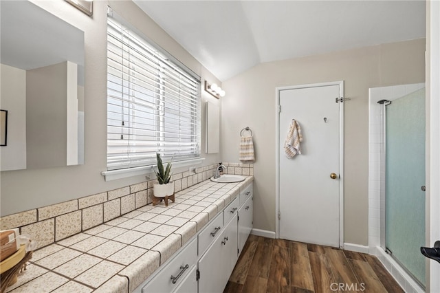 15113 Hayford St, La Mirada, CA 90638 - full bathroom with vaulted ceiling, vanity, wood finished floors, and a stall shower
