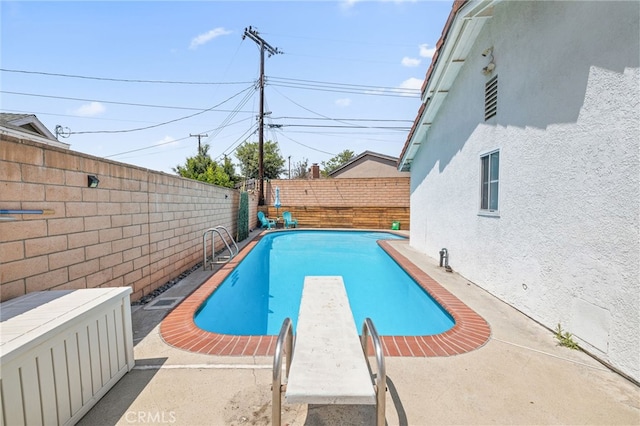 15113 Hayford St, La Mirada, CA 90638 - view of swimming pool with a fenced backyard, a diving board, and a patio area
