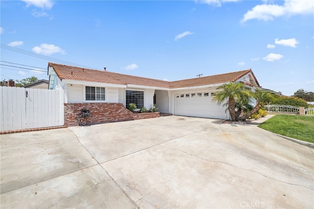 15113 Hayford St, La Mirada, CA 90638 - single story home featuring concrete driveway, a garage, a tiled roof, stucco siding, and brick siding