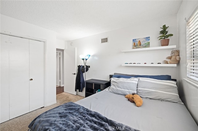 15113 Hayford St, La Mirada, CA 90638 - bedroom with carpet floors, multiple windows, a closet, a textured ceiling, and baseboards