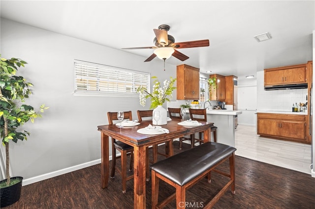 15113 Hayford St, La Mirada, CA 90638 - dining area with ceiling fan, baseboards, and light wood-style flooring