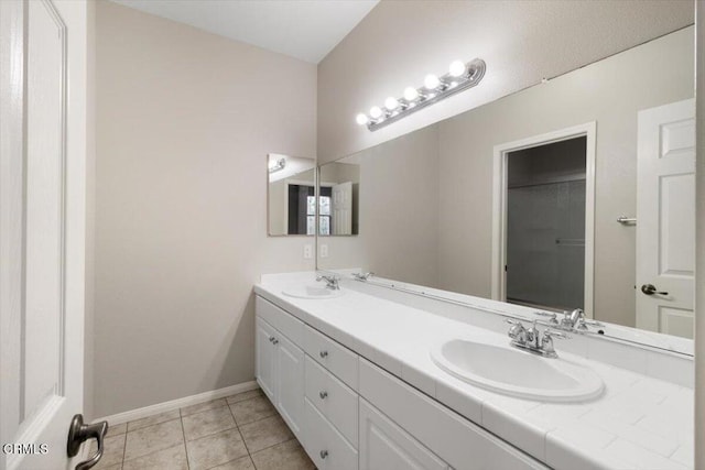 5611 Dorsey St, Ventura, CA 93003 - bathroom featuring double vanity and tile patterned floors