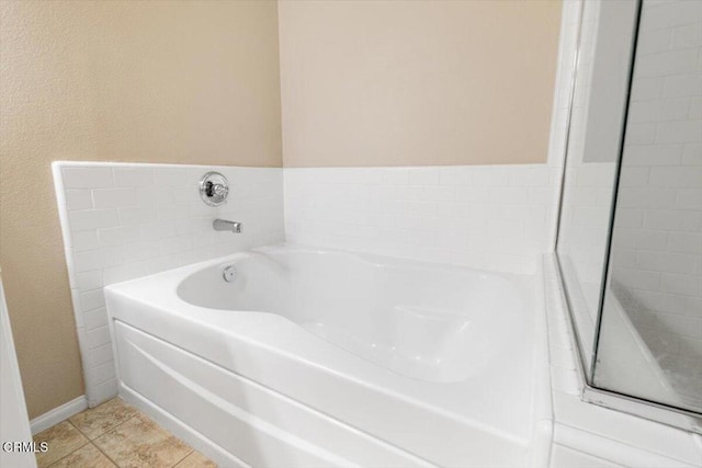 5611 Dorsey St, Ventura, CA 93003 - bathroom featuring a bath and tile patterned floors