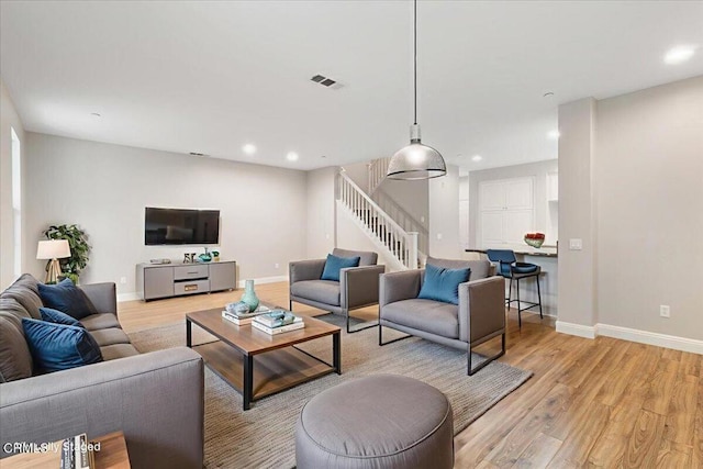 5611 Dorsey St, Ventura, CA 93003 - living area with stairway, light wood-style flooring, and recessed lighting