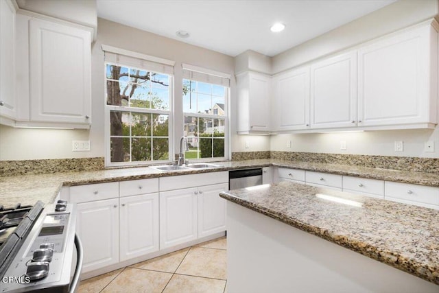 5611 Dorsey St, Ventura, CA 93003 - kitchen with range, white cabinets, light tile patterned floors, light stone countertops, and recessed lighting