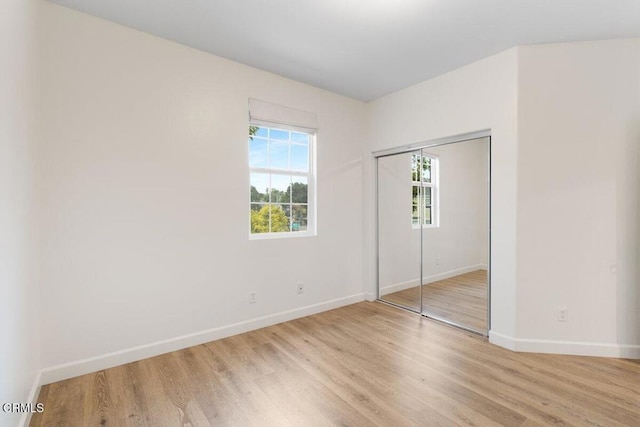 5611 Dorsey St, Ventura, CA 93003 - unfurnished bedroom with light wood-style flooring and a closet