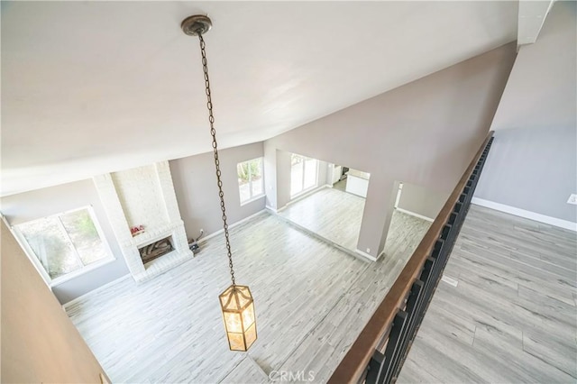 6114 Sard St, Rancho Cucamonga, CA 91701 - detailed view of wood finished floors, a brick fireplace, and baseboards