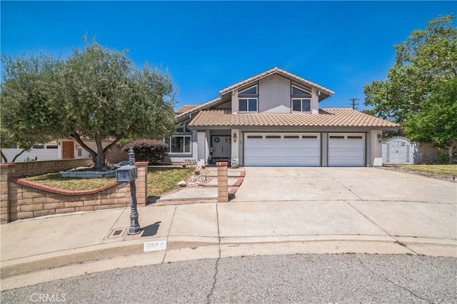 6114 Sard St, Rancho Cucamonga, CA 91701 - traditional-style home with a tiled roof, concrete driveway, a gate, stucco siding, and an attached garage
