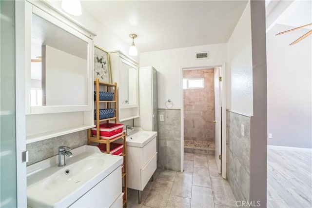 6114 Sard St, Rancho Cucamonga, CA 91701 - full bath featuring a walk in shower, two vanities, and tile patterned floors