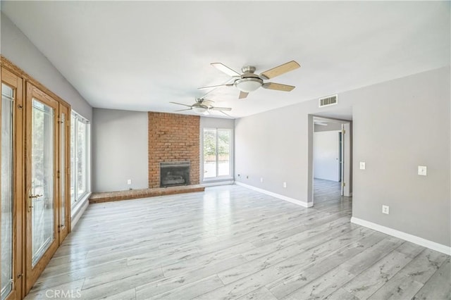 6114 Sard St, Rancho Cucamonga, CA 91701 - unfurnished living room featuring ceiling fan, baseboards, light wood-style flooring, and a fireplace