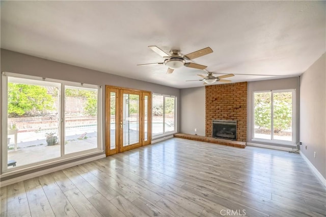 6114 Sard St, Rancho Cucamonga, CA 91701 - unfurnished living room with ceiling fan, wood finished floors, a fireplace, and baseboards