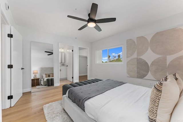 4532 Dawson Ave Unit 3, San Diego, CA 92115 - bedroom featuring light wood-style floors, a ceiling fan, baseboards, ensuite bath, and a walk in closet