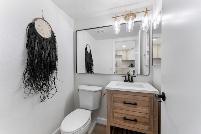 4532 Dawson Ave Unit 3, San Diego, CA 92115 - bathroom featuring vanity, toilet, and backsplash