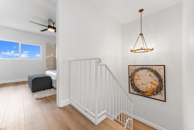 4532 Dawson Ave Unit 3, San Diego, CA 92115 - stairway with a chandelier, wood finished floors, baseboards, and a ceiling fan