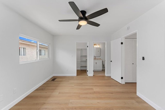 4532 Dawson Ave Unit 3, San Diego, CA 92115 - unfurnished bedroom with a walk in closet, light wood finished floors, baseboards, and connected bathroom