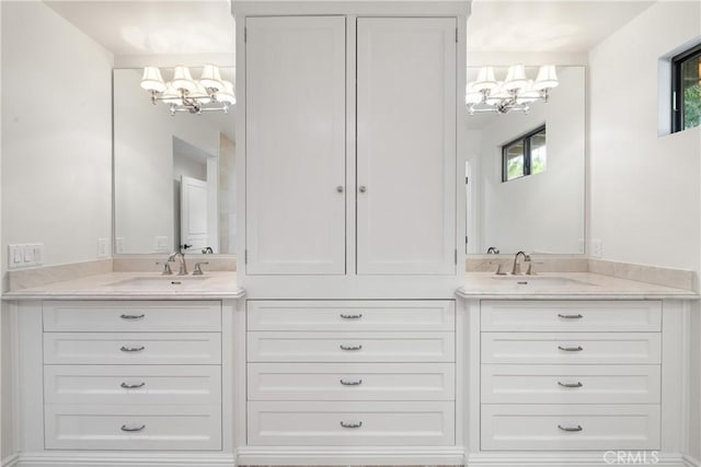 72408 Desert Dr, Rancho Mirage, CA 92270 - bathroom featuring a chandelier and double vanity