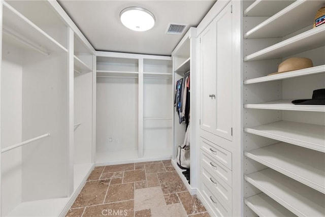 72408 Desert Dr, Rancho Mirage, CA 92270 - walk in closet featuring stone tile floors