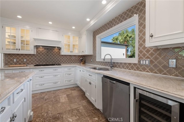72408 Desert Dr, Rancho Mirage, CA 92270 - kitchen with stainless steel dishwasher, a sink, wine cooler, white cabinetry, and recessed lighting