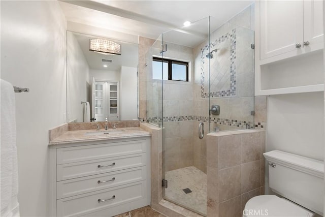 72408 Desert Dr, Rancho Mirage, CA 92270 - bathroom featuring vanity, toilet, and a shower stall