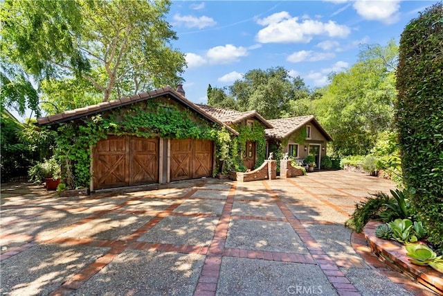 302 W Carter Ave, Sierra Madre, CA 91024 - rustic home featuring a tiled roof and a garage