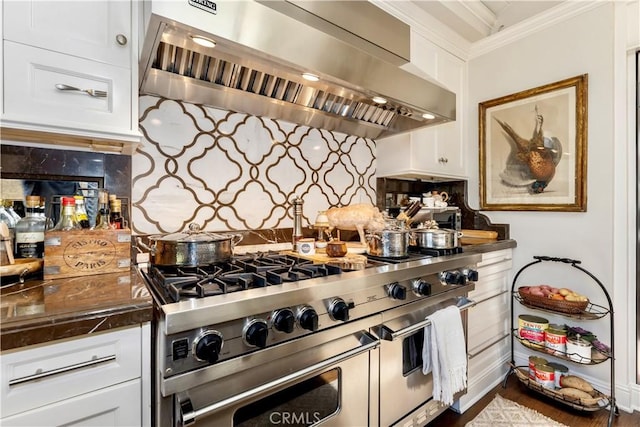 302 W Carter Ave, Sierra Madre, CA 91024 - kitchen with wall chimney range hood, double oven range, ornamental molding, backsplash, and white cabinetry