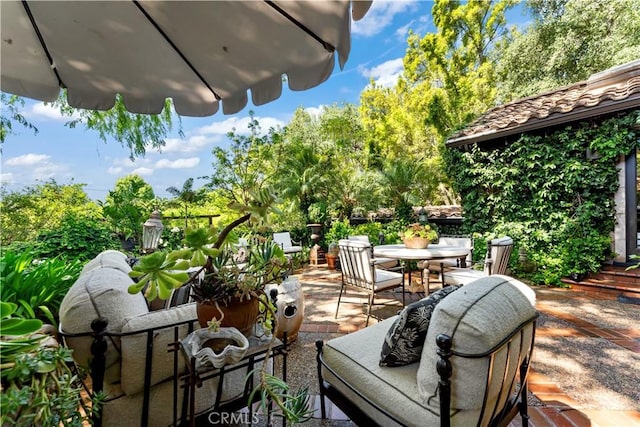 302 W Carter Ave, Sierra Madre, CA 91024 - view of patio with outdoor dining area and view of scattered trees