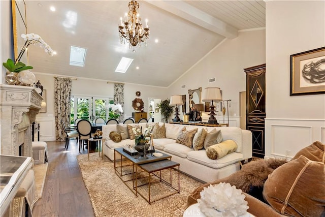 302 W Carter Ave, Sierra Madre, CA 91024 - living room with a decorative wall, beam ceiling, wood finished floors, a fireplace, and a skylight