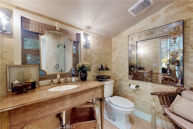 302 W Carter Ave, Sierra Madre, CA 91024 - bathroom with a sink, vaulted ceiling, toilet, tile patterned floors, and wallpapered walls