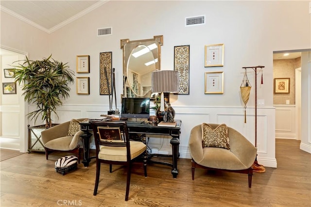 302 W Carter Ave, Sierra Madre, CA 91024 - living area with a decorative wall, high vaulted ceiling, wood finished floors, a wainscoted wall, and crown molding