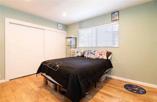 900 E Sagebank St, Carson, CA 90746 - bedroom featuring wood finished floors, a closet, baseboards, and recessed lighting