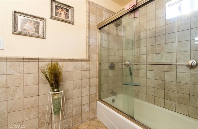900 E Sagebank St, Carson, CA 90746 - full bath with tile walls, combined bath / shower with glass door, a wainscoted wall, and tile patterned flooring