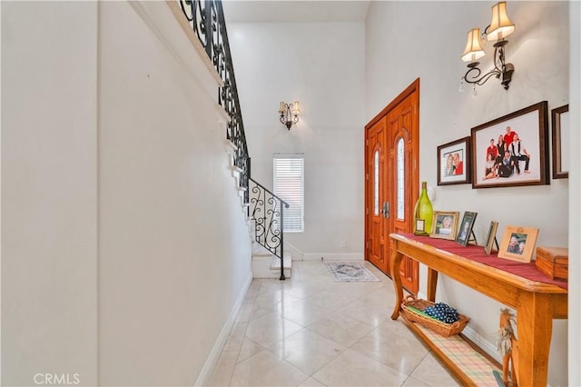 724 S Broadway Unit B, Redondo Beach, CA 90277 - foyer with stairs, baseboards, a high ceiling, and light tile patterned flooring