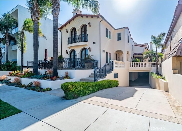 724 S Broadway Unit B, Redondo Beach, CA 90277 - mediterranean / spanish home with a balcony, stucco siding, concrete driveway, and a garage