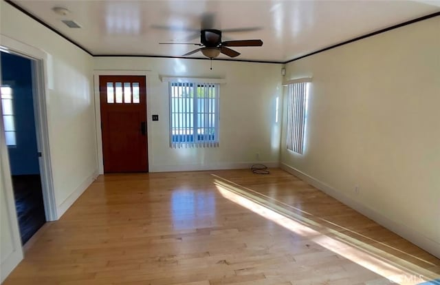 3513 Denker Ave, Los Angeles, CA 90018 - entryway with a ceiling fan, light wood finished floors, and baseboards
