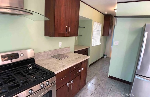 3513 Denker Ave, Los Angeles, CA 90018 - kitchen with appliances with stainless steel finishes, light tile patterned flooring, dark brown cabinets, and baseboards
