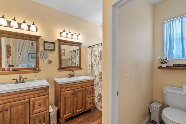 31081 Bunker Dr, Temecula, CA 92591 - full bathroom with two vanities, toilet, and wood finished floors