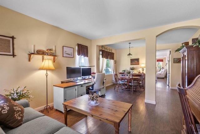 31081 Bunker Dr, Temecula, CA 92591 - living room with baseboards, arched walkways, and wood finished floors