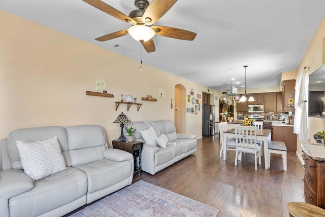 31081 Bunker Dr, Temecula, CA 92591 - living area with a ceiling fan, arched walkways, dark wood-style flooring, baseboards, and recessed lighting