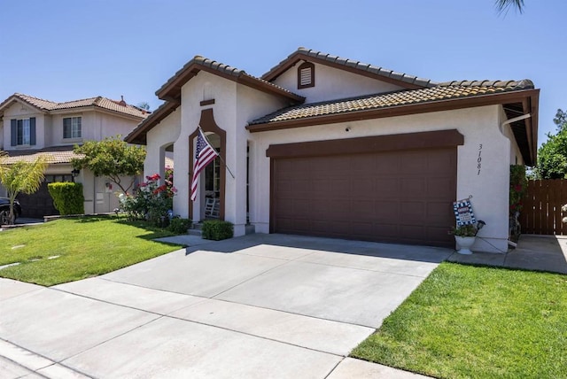 31081 Bunker Dr, Temecula, CA 92591 - mediterranean / spanish house featuring a garage, concrete driveway, a front lawn, and stucco siding