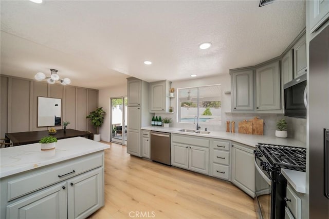 28732 Paseo Diablo, Menifee, CA 92587 - kitchen with appliances with stainless steel finishes, a sink, plenty of natural light, light wood-type flooring, and recessed lighting