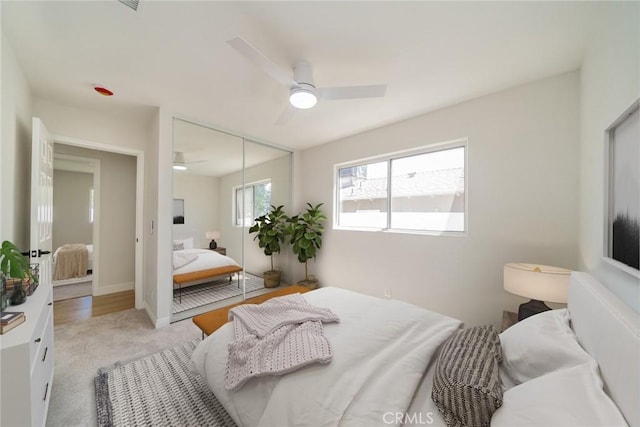 28732 Paseo Diablo, Menifee, CA 92587 - bedroom with a closet, light carpet, and a ceiling fan