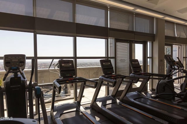 1155 S Grand Ave Unit 1403, Los Angeles, CA 90015 - exercise room featuring a towering ceiling